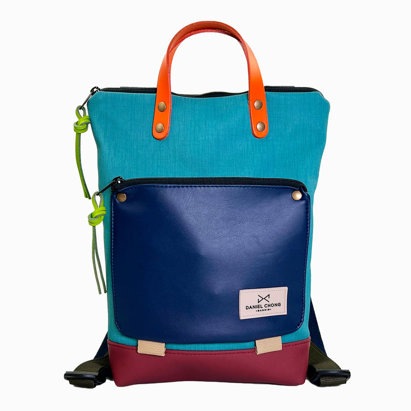 Mochila Mini Book Holder Impermeable con bolsillo extra Daniel Chong - Turquesa con bolsillo azul marino