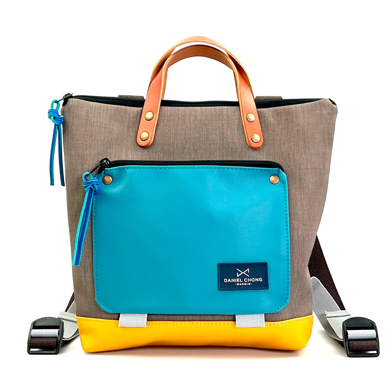 Mochila Mini Book Holder Cuadrada Impermeable con bolsillo extra Daniel Chong - Gris con bolsillo azul