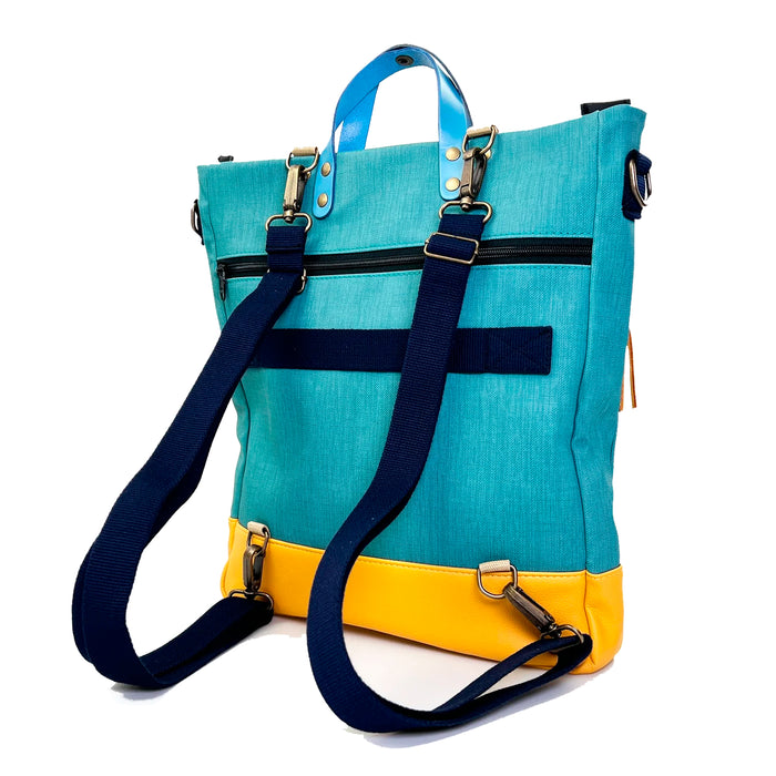 Bolso-mochila Worker Bag de Daniel Chong - Turquesa con bolsillo fucsia