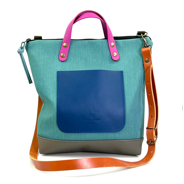 Bandolera cuadrada impermeable con asas veganas Daniel Chong - Turquesa con bolsillo azul