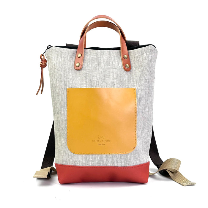 Mochila Mini Impermeable con bolsillo extra Daniel Chong - Gris con bolsillo amarillo