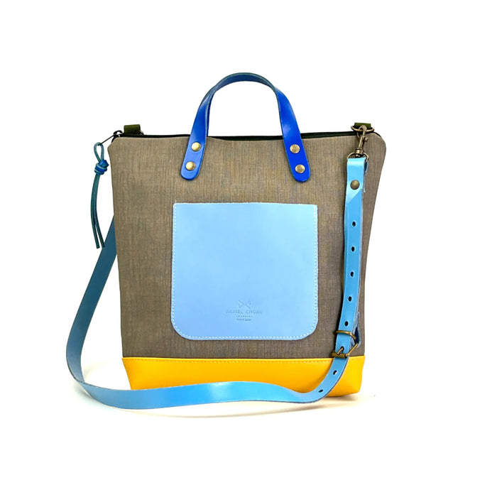 Bandolera cuadrada impermeable Daniel Chong - Gris, bolsillo azul y base amarilla