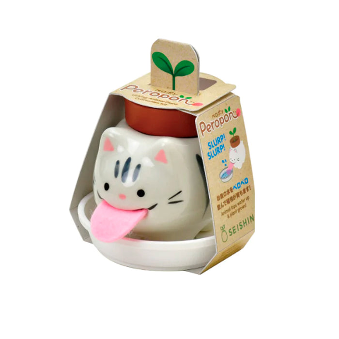 Kit de cultivo de albahaca con maceta en forma de gato rayado gris, bandeja de plástico blanco, tierra y semillas.