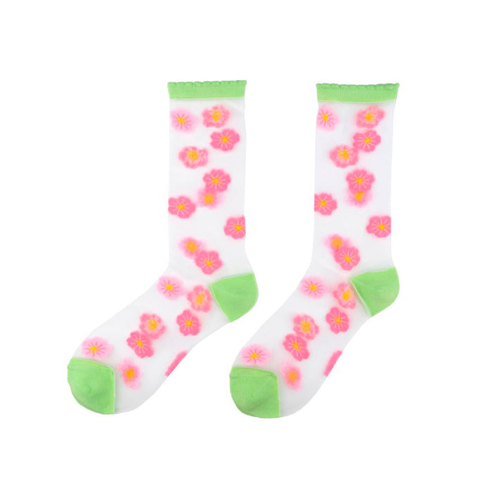 Calcetines de malla transparentes con dibujos de flores de cerezo rosa pálido y rosa. Calcetines con estampado de flores de cerezo con el remate, el talón y la punta en verde pistacho.