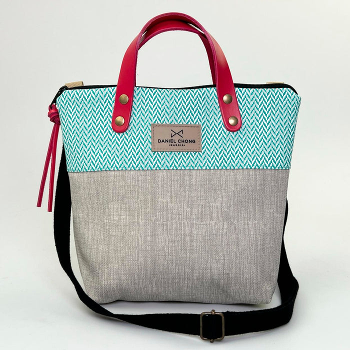 Bandolera mini impermeable con asas Daniel Chong - Asas rojo cuerpo espiga turquesa y gris