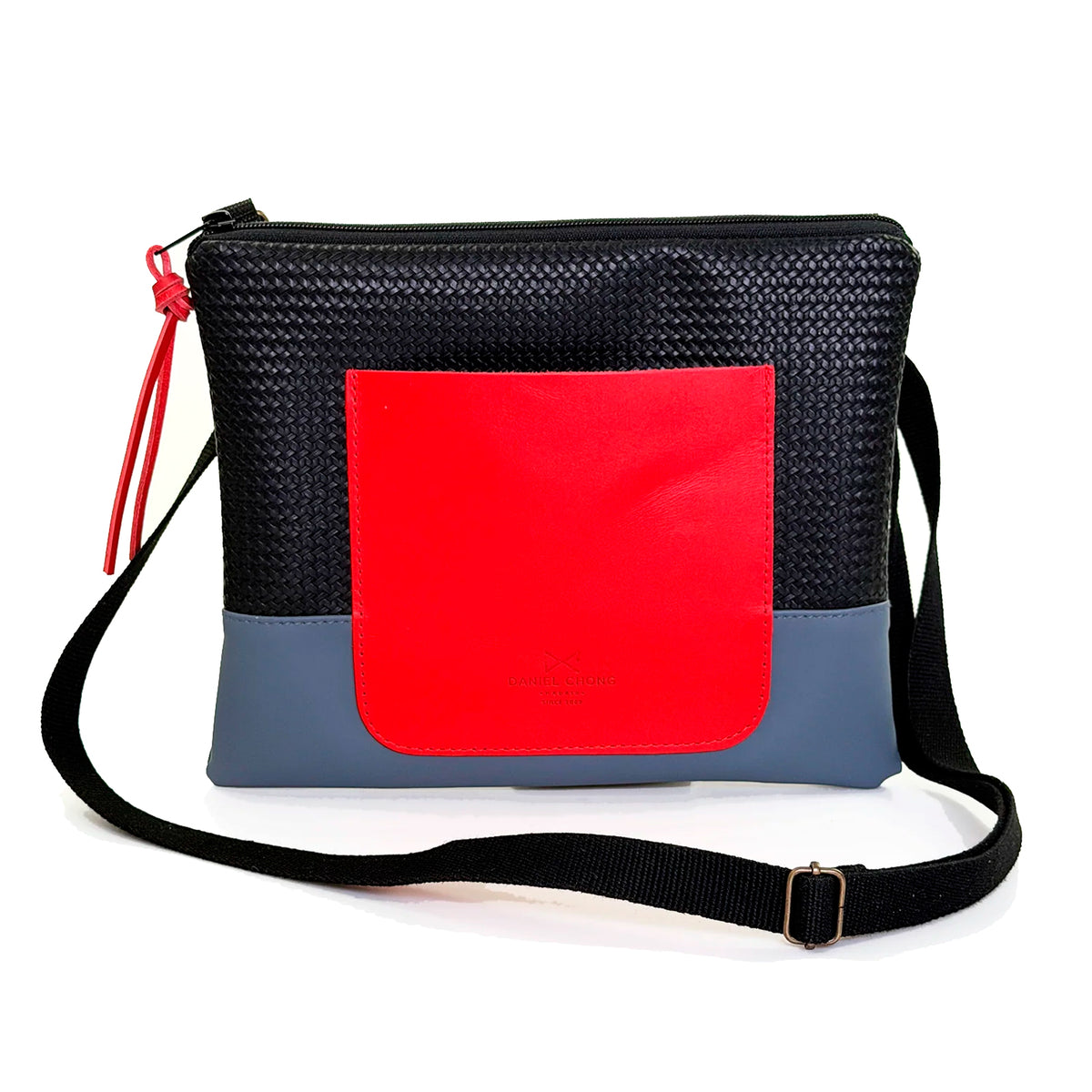 Bandolera mini impermeable con bolsillo Daniel Chong - Negro y azul con bolsillo rojo