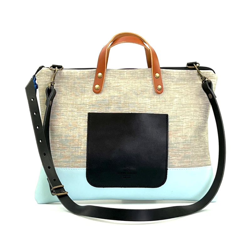 Bandolera Slim Impermeable Daniel Chong - Gris con bolsillo negro y base azul