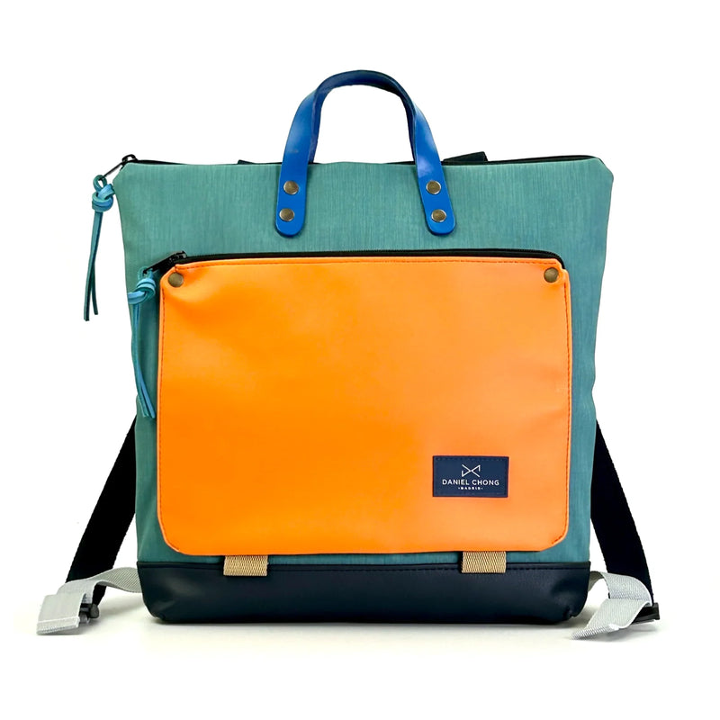 Mochila Book Holder Cuadrada Impermeable con bolsillo extra Daniel Chong - Turquesa con bolsillo naranja