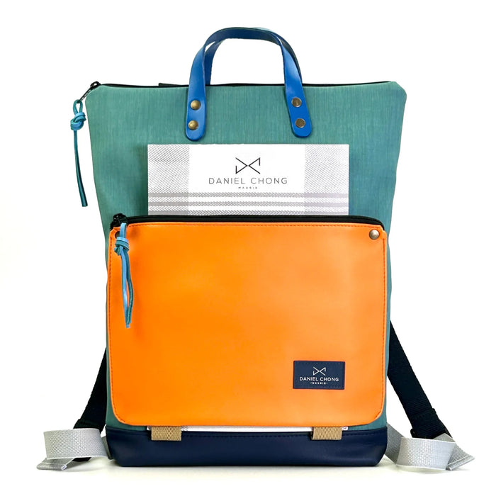 Mochila Book Holder Impermeable con bolsillo extra Daniel Chong - Turquesa con bolsillo naranja