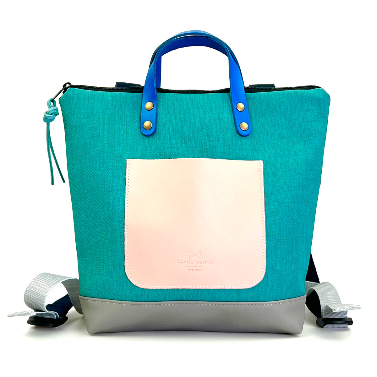 Mochila Mini Cuadrada Impermeable con bolsillo extra Daniel Chong - Turquesa con bolsillo rosa