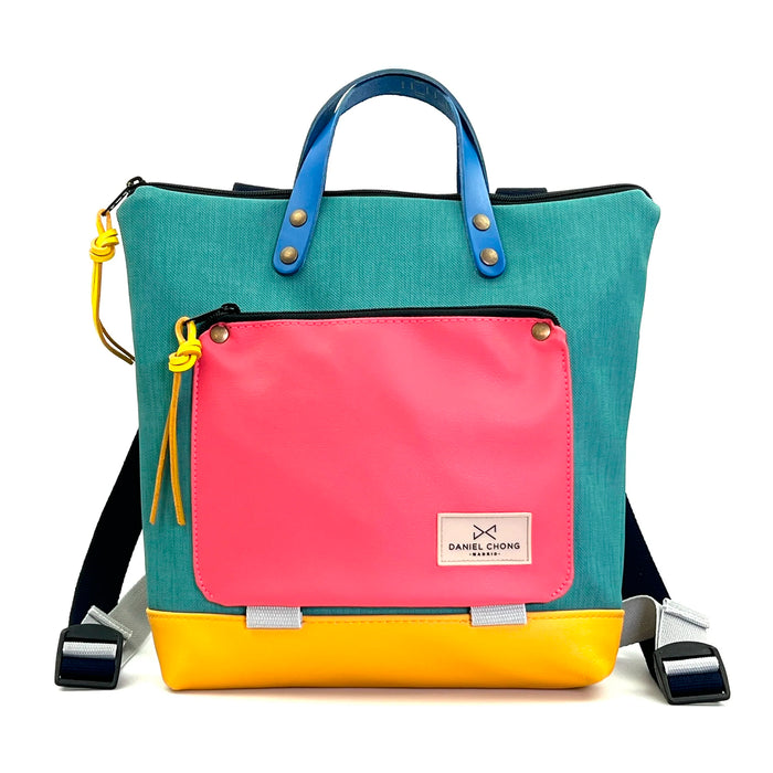 Mochila Mini Book Holder Cuadrada Impermeable con bolsillo extra Daniel Chong - Turquesa con bolsillo fucsia