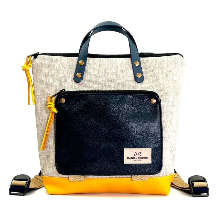 Mochila Mini Book Holder Cuadrada Impermeable con bolsillo extra Daniel Chong - Gris con bolsillo azul