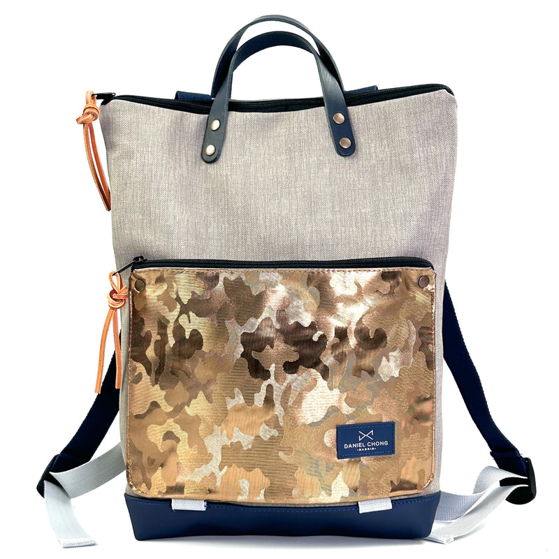 Mochila Book Holder Impermeable con bolsillo extra Daniel Chong - Gris con bolsillo dorado