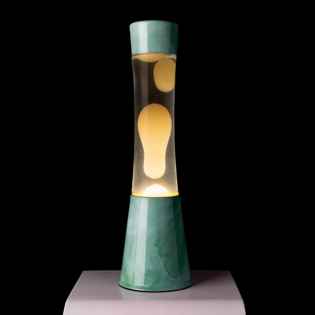 Lámpara de lava Fisura - Base jade, líquido transparente, lava blanca