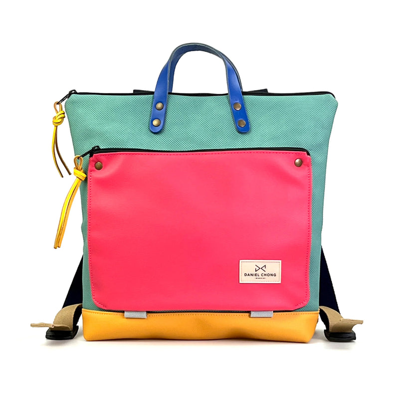 Mochila Book Holder Cuadrada Impermeable Daniel Chong - Turquesa con bolsillo fucsia y base amarilla