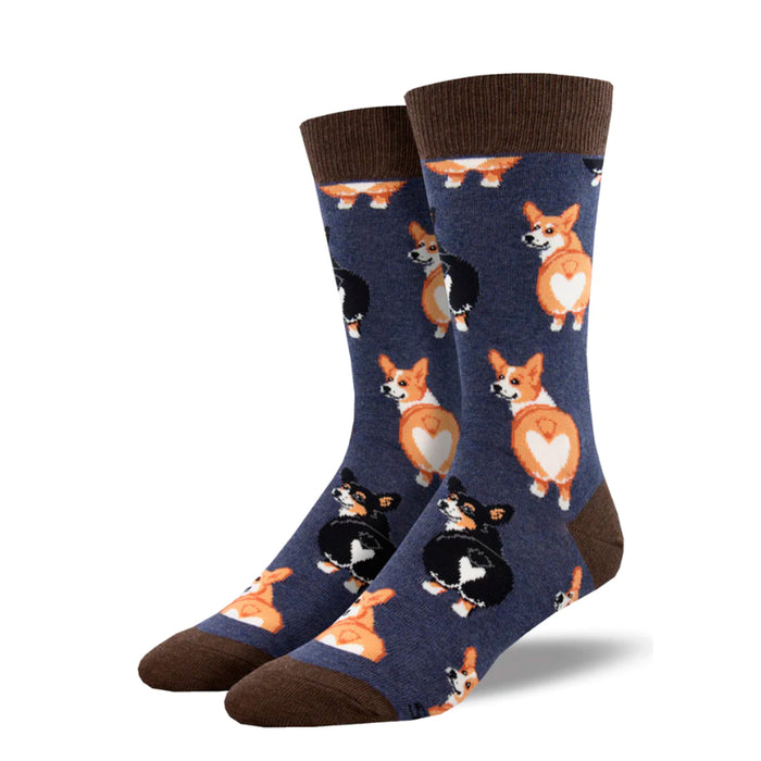 Calcetines de color azul oscuro con estampado de perros corgi rubios y negros de espalda mostrando el culo con pelaje en forma de corazón y puntera, talón y goma en color marrón.