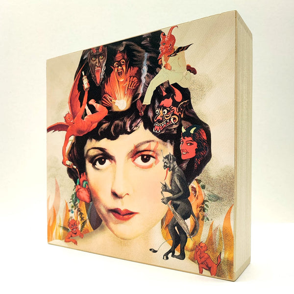 Caja de luz de madera y papel con la imagen de un rostro femenino rodeado de llamas y demonios. Caja de luz hecha de forma manual con imagen de rostro de mujer vintage, demonios y llamas.